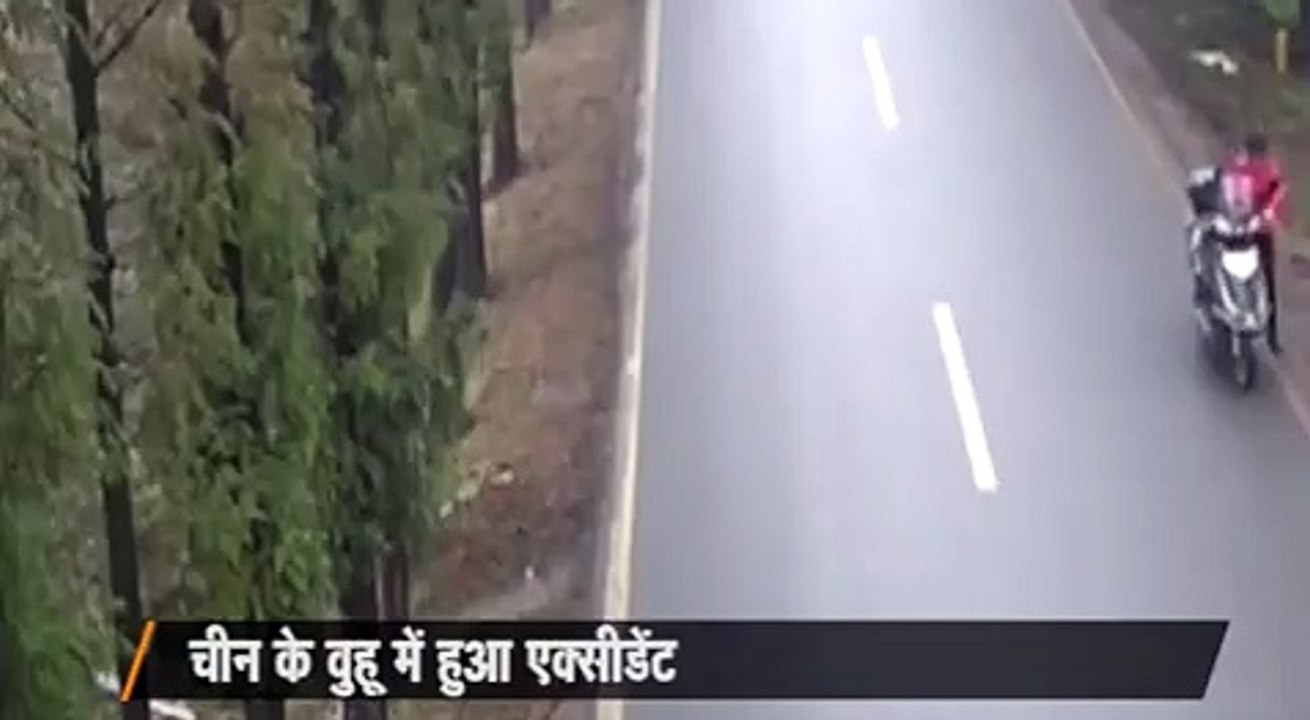 Shocking footage shows the moment a motorcyclist in China crashes head-on with a van and survives