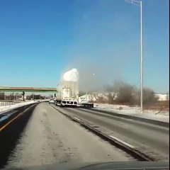 Surplus Of Snow Explodes As Truck Passes Under Bridge