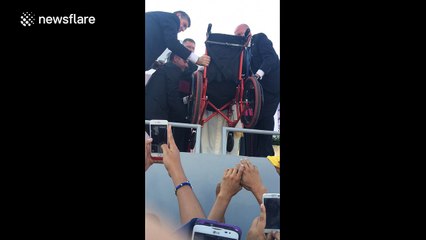 Pope breaks protocol during Mexico visit to bless child in wheelchair