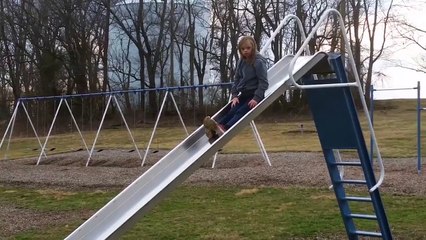Girl Barely Goes Down Squeaky Slide