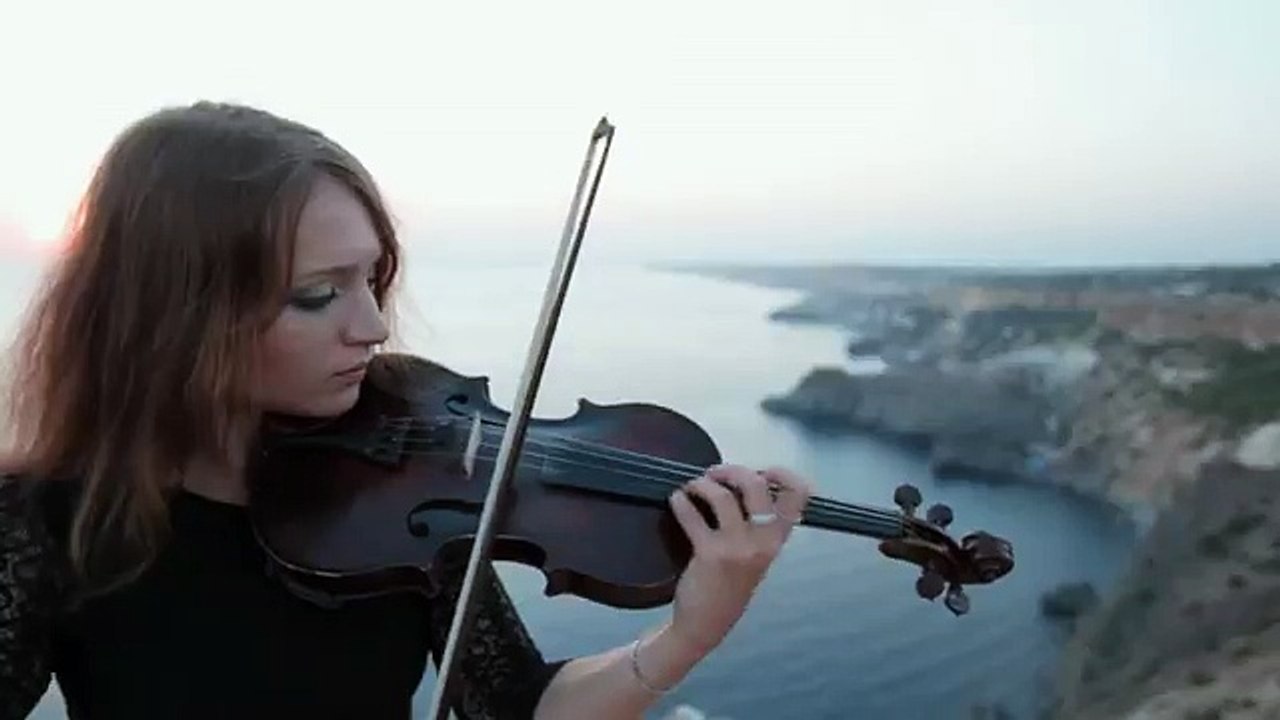 Violinist stands on the cliff on the sea and plays (Funny Videos 720p)