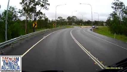 Driver spins out on oily road - QLD