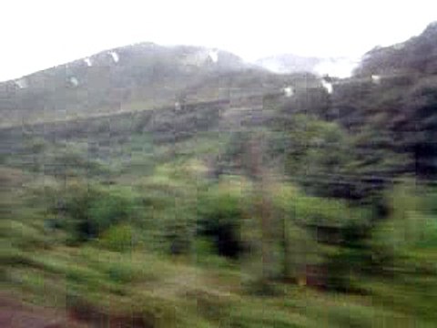 Вид на горы из окна электропоезда (Mountain view from the window of the train)