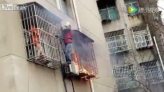 Man rescues woman from burning room on 3rd floor