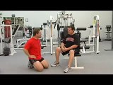 Cincinnati weight loss expert and Ty Collins perform tricep dips.