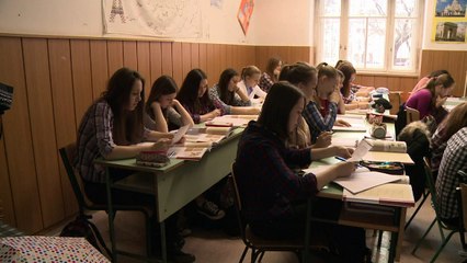 Hungarian teachers, pupils wear checked tops to protest slur