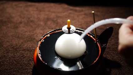 Magic: spinning top levitated into big Bubble full of smoke!