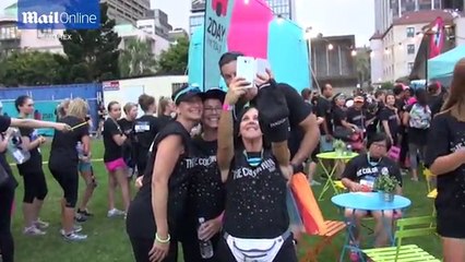 Sam Wood dons tutu and poses with fans at The Colour Run