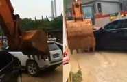 Company in China Fed up With Illegal Parking Rents an Excavator