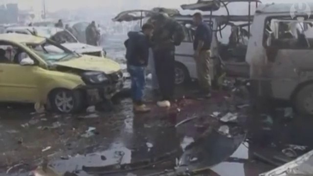 Aftermath of twin blasts that killed dozens in Homs