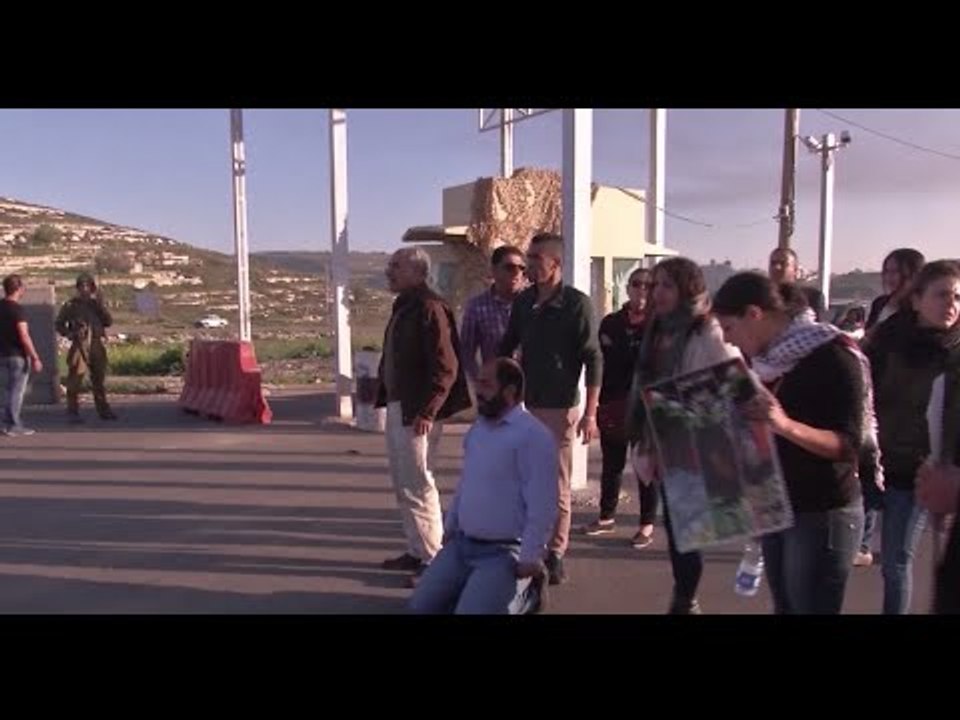 Israeli women monitor soldiers guarding West Bank checkpoints