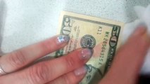 She Thought She Had A $50 Bill...Until She Rubbed It With Alcohol