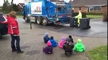 Danish children in daycare watching the garbagetruck