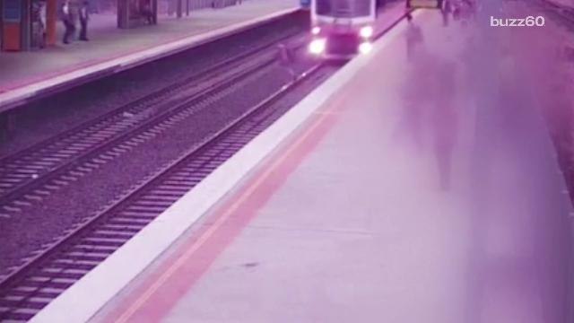 Man barely survives trying to cross train tracks caught on video