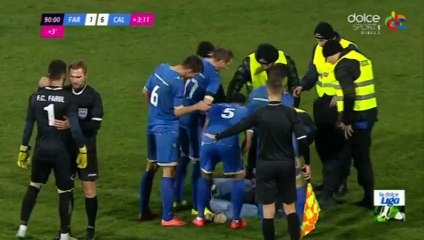 Goalkeeper fighting with a fan during a football game in Romania