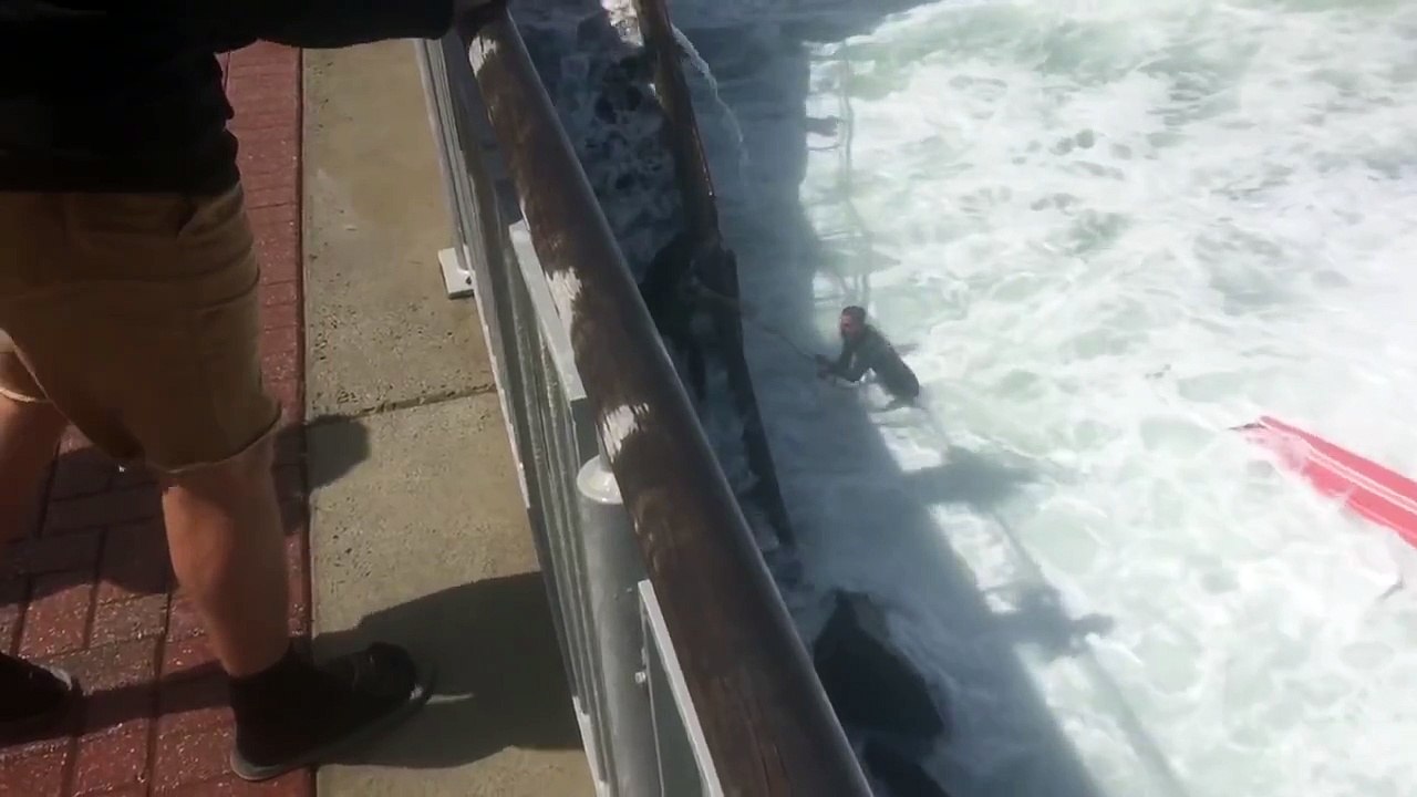 Waves Crash into Surfer during High Tide