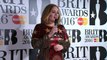 Adele reacts to record-breaking BRITs win