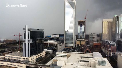 See a storm rolling through a city in lightning speed