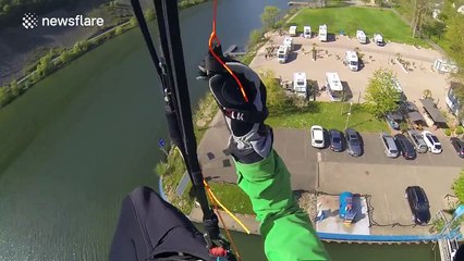 Paraglider crashes into river