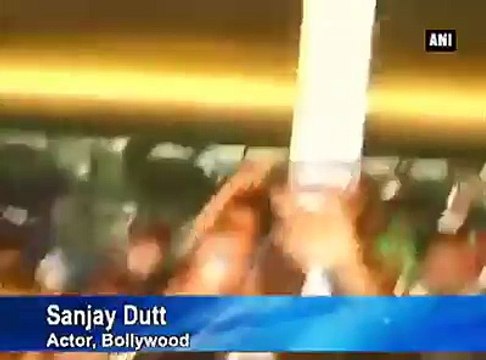 Sanjay Dutt kisses the ground as he walks free from jail.