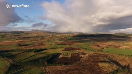 Drone footage of an isolated snow shower over the Northern Ireland countryside