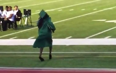 Girl's Shoes Make Her Wipe Out During Graduation Ceremony