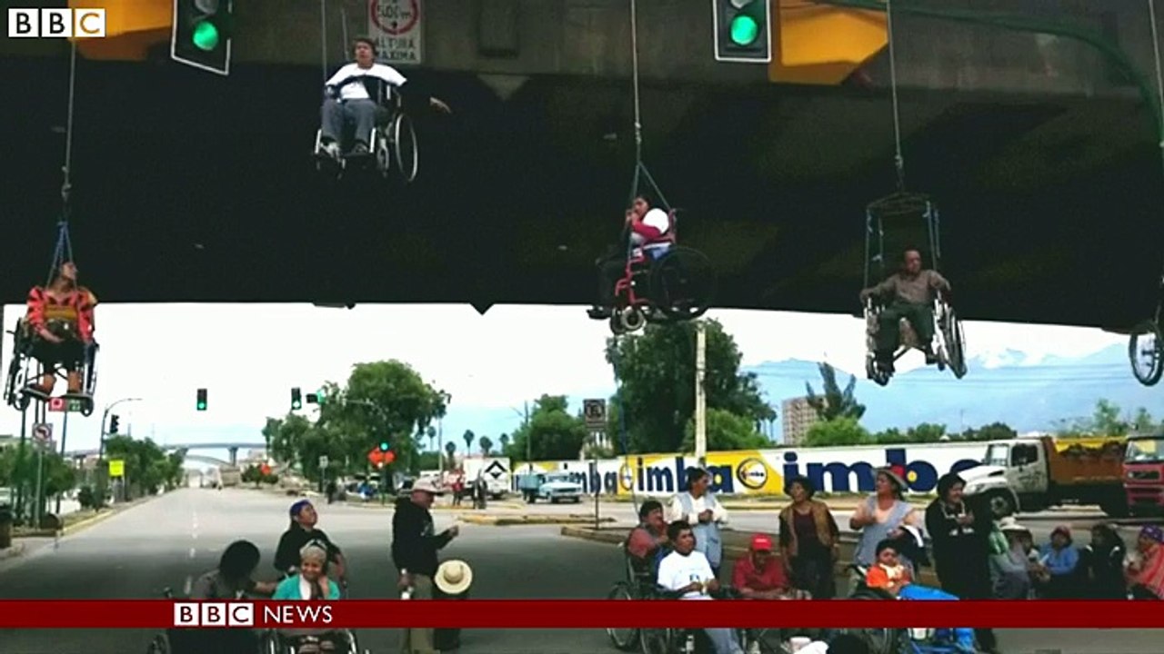 Wheelchair users suspended from bridge in Bolivia - BBC News