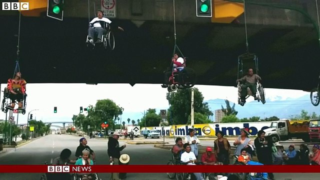 Wheelchair users suspended from bridge in Bolivia - BBC News