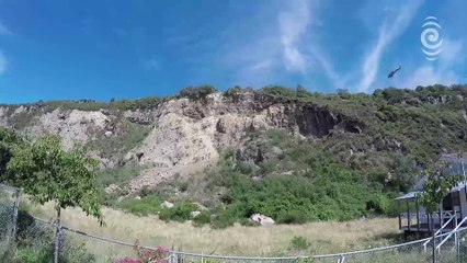 Time-lapse of a helicopter loosening rocks on Sumner Cliff
