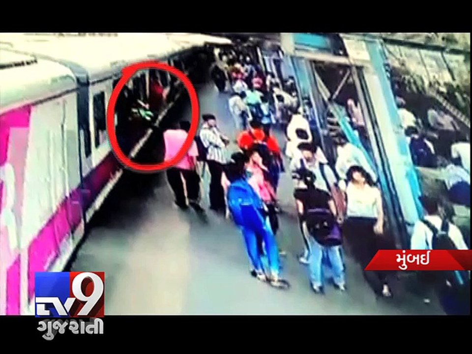 Mumbai - 20-year old leans out of train, bangs into traffic pole  - Tv9 Gujarati