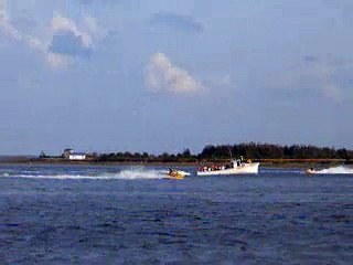seadoo jumping wakes made by a fishing boat