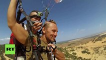 Exteme Barber: Skydiver shaving partners head while parachuting