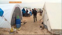 Syrian refugees crowd border camp after air strikes