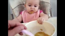 baby trying to eat food funny :D