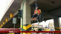 Wheelchair users suspended from bridge in Bolivia
