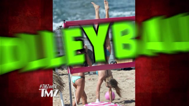 Victoria’s Secret Models are playing beach volleyball and Nick Jonas is the referee!