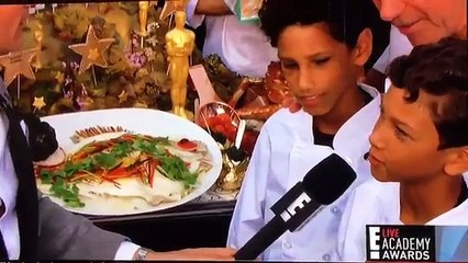 RYAN SEACREST INTERVIEWS WOLFGANG PUCK WHO PROVIDES STARS WITH FOOD AT OSCARS 2016