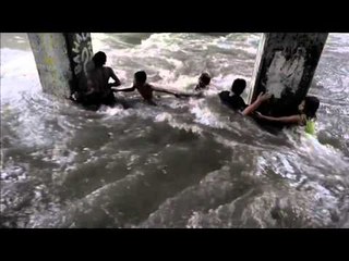 Kids play in swollen creeks caused by Typhoon ‘Nona’