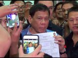 Duterte seals presidential bid, personally files COC