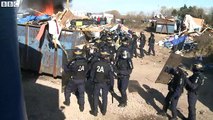 Rocks thrown at riot police as Calais camp is dismantled