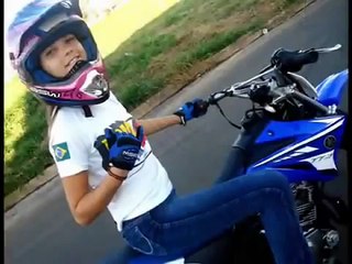 Aline teenage girl doing powerful stunts on bike