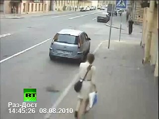 CCTV: Womans narrow escape from car crash chaos