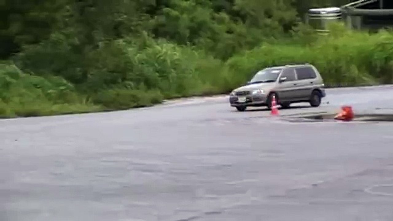 Guy in a stock Ford something er other , Gymkhana