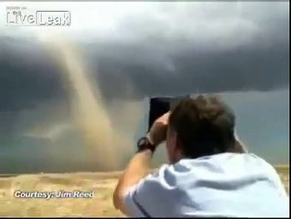 Crazy guy running into tornado