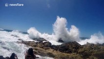 Large waves crashing against the rocks at Byron Bay