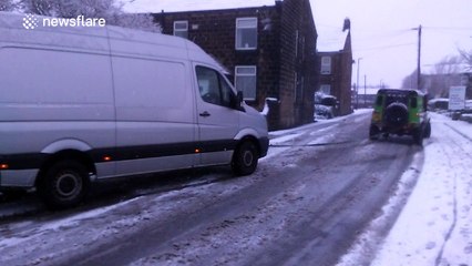 Van being towed after getting caught in Storm Jake snow