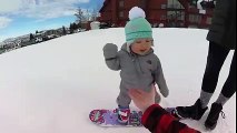 little boy of 14 months makes perfect skiing
