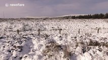 Drone shows snow coating Northern Ireland mountain pass