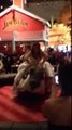 Bride rides mechanical bull in wedding gown