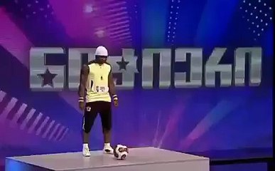 boy freestyle soccer skills showing on stage